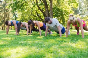 Group Doing Planks at the Park